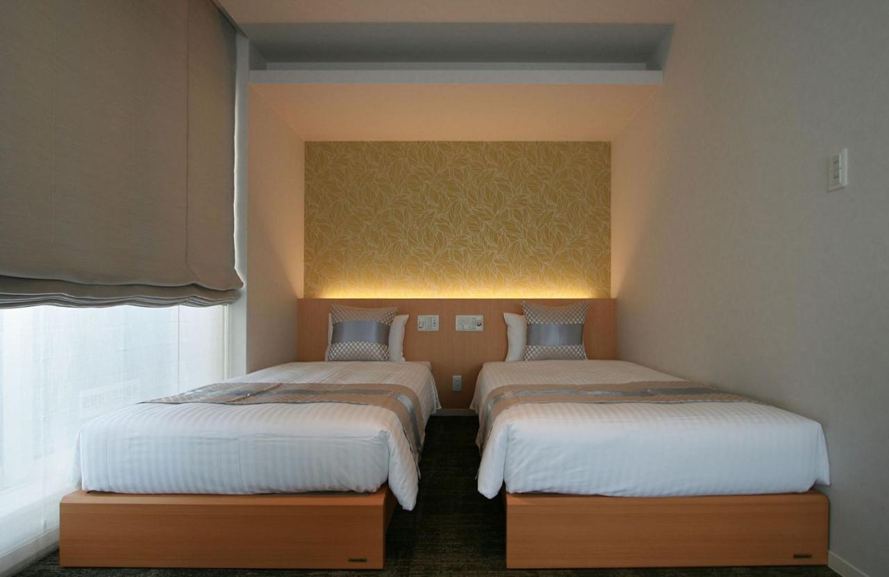 Aparthotel Grand Base Okayama Ekimae Esterno foto
