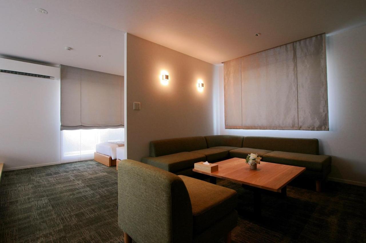 Aparthotel Grand Base Okayama Ekimae Esterno foto