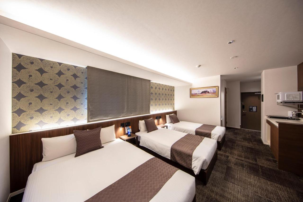 Aparthotel Grand Base Okayama Ekimae Esterno foto