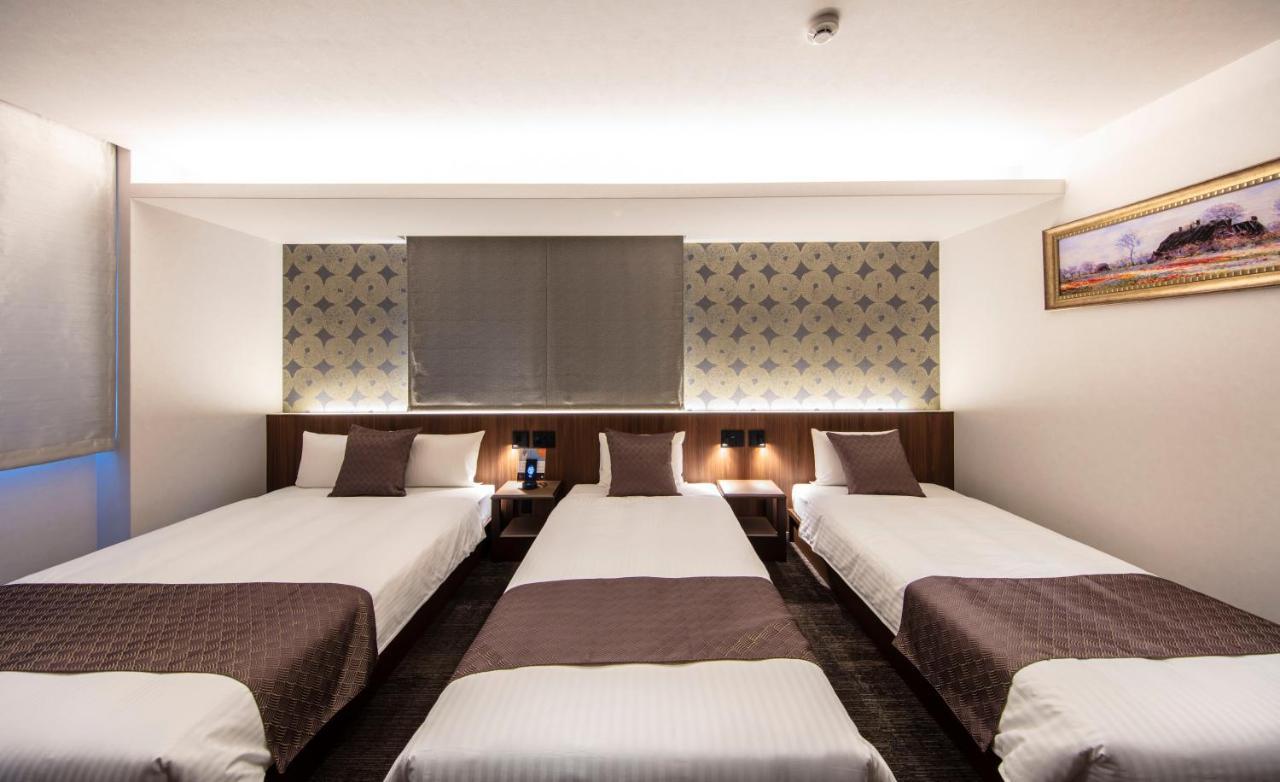 Aparthotel Grand Base Okayama Ekimae Esterno foto