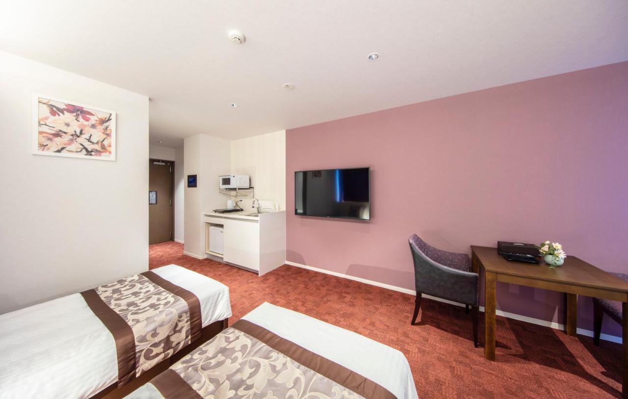 Aparthotel Grand Base Okayama Ekimae Esterno foto