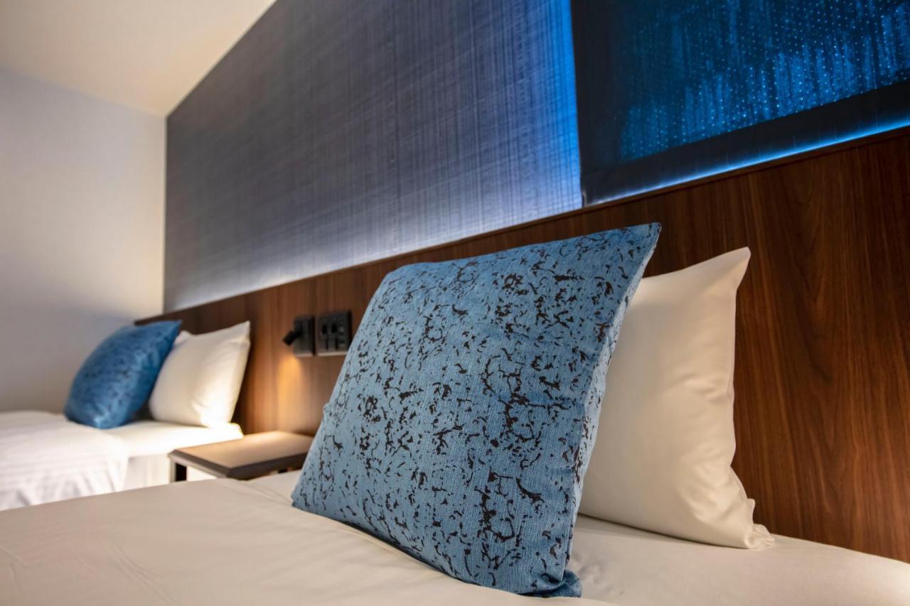 Aparthotel Grand Base Okayama Ekimae Esterno foto